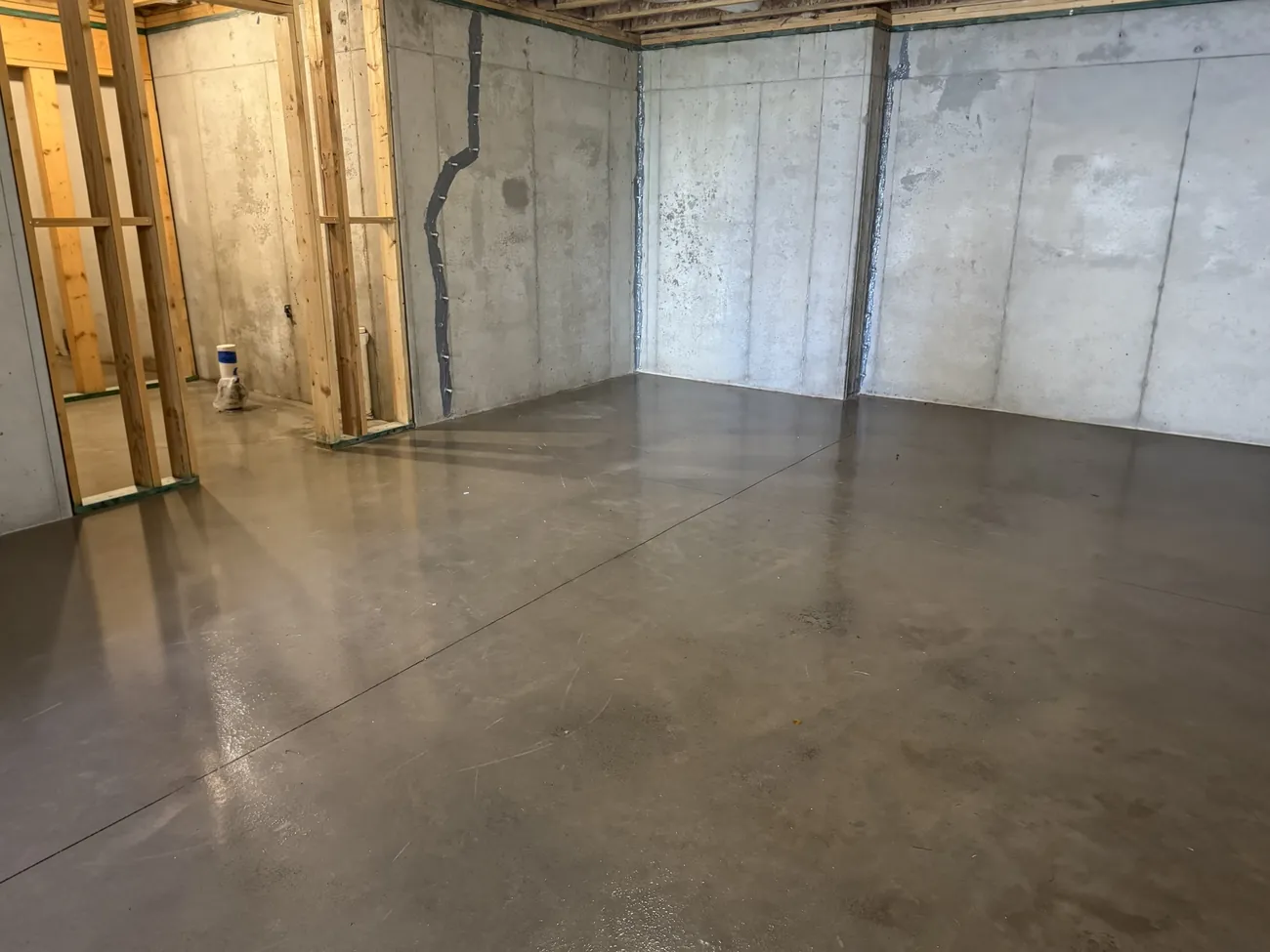 The same basement after the cleanout, with a clear concrete floor