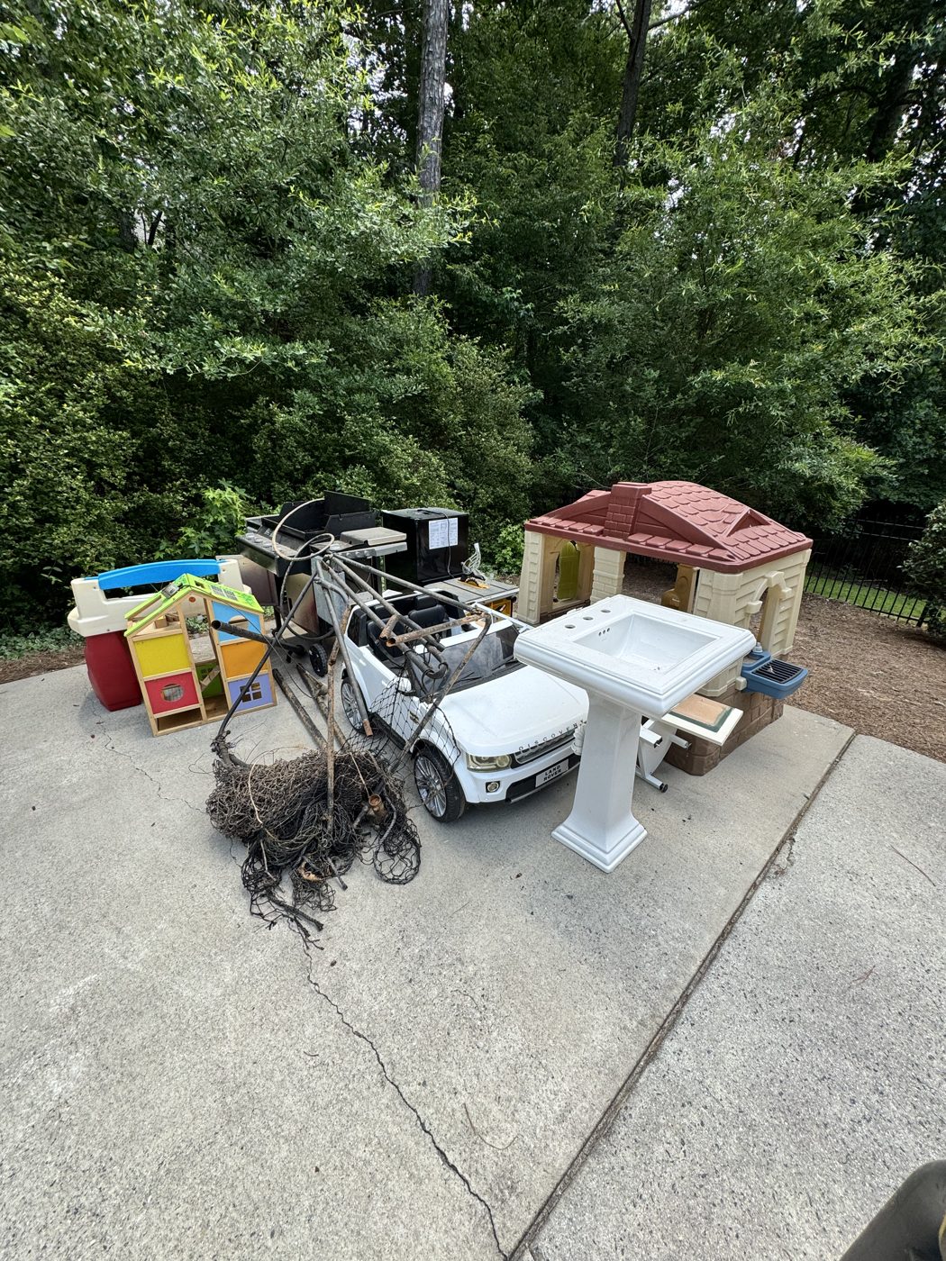 Before junk removal in Milton, GA: patio cleanout
